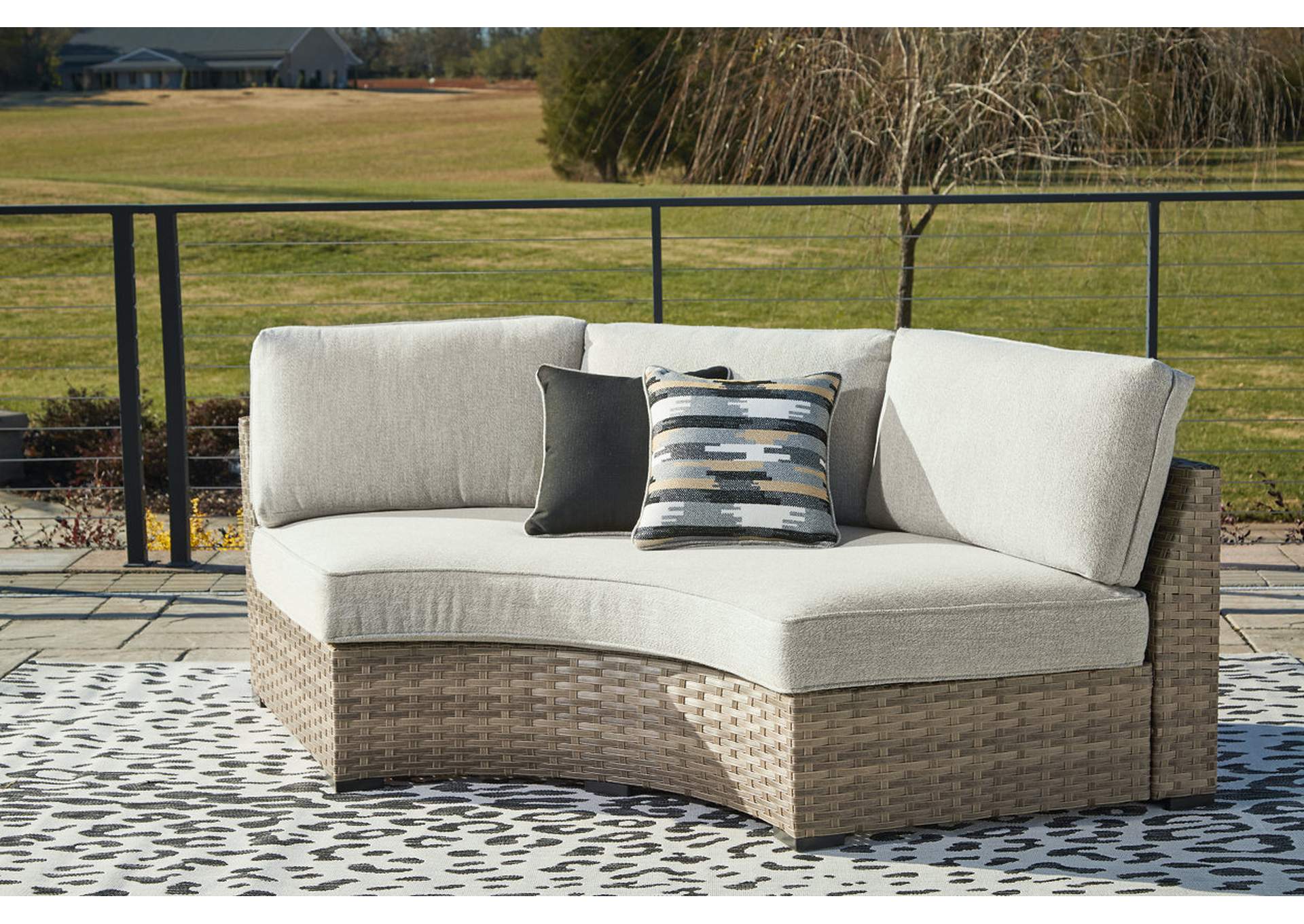 Calworth Outdoor Curved Loveseat with Cushion,Outdoor By Ashley